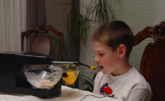 Child Using a Mealtime Partner Dining Device