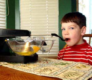 Child using the Mealtime Partners Dining System
